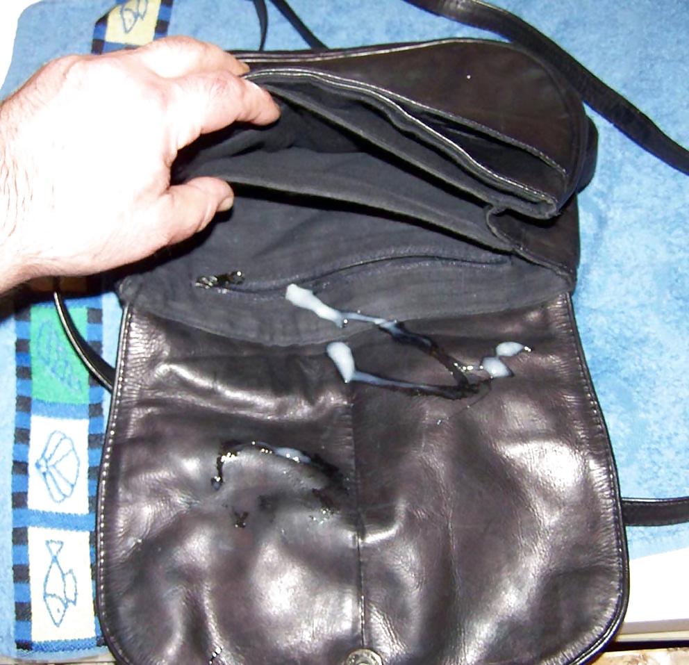 Cum for black leather handbag #31667385