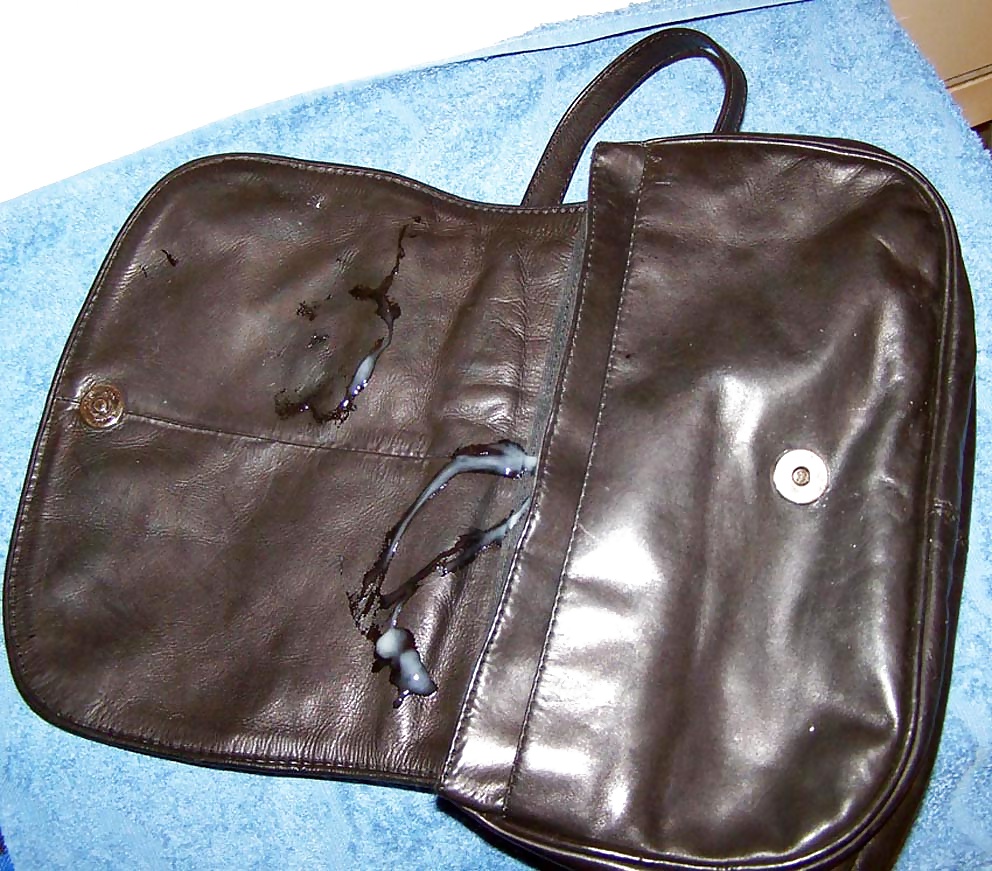 Cum for black leather handbag #31667390