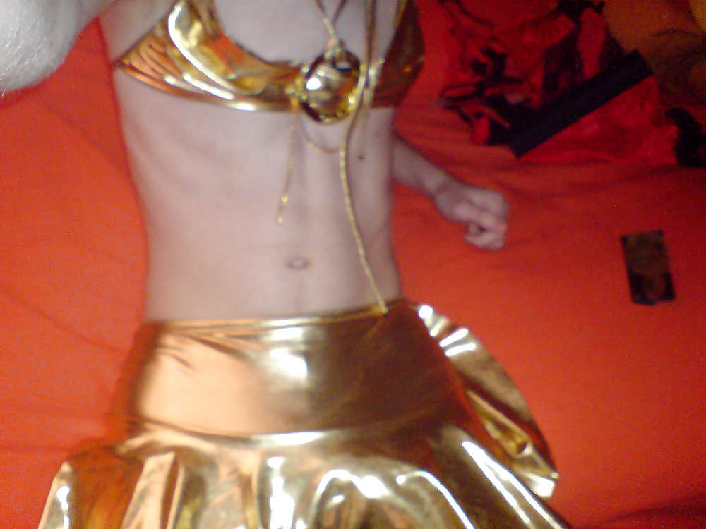 Sissy wears a gold mini skirt & bra #35904168