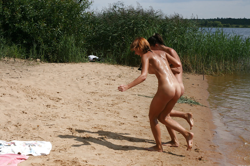 Nudists at the lake. #28235304