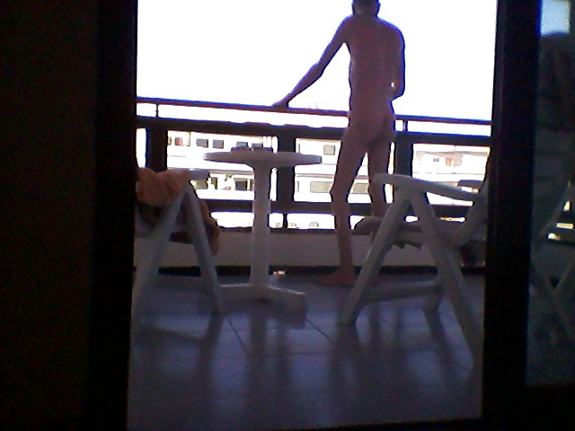 Flashing nude on a hotel balcony #28572307