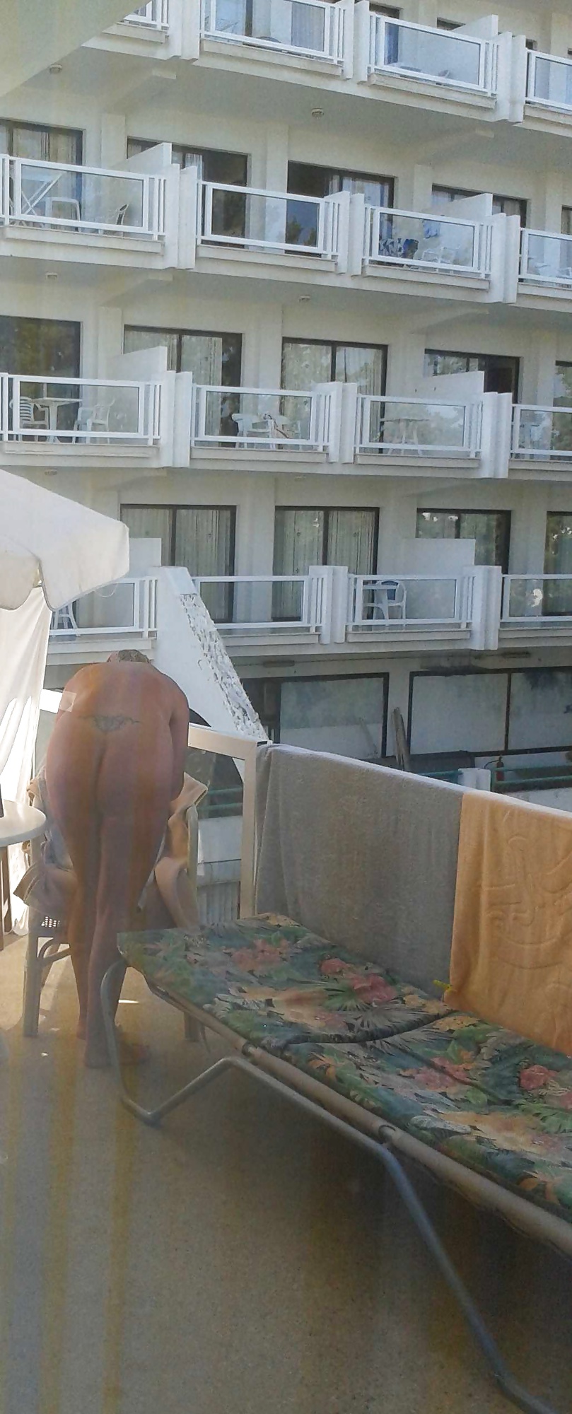 Flashing nude on a hotel balcony #28572322