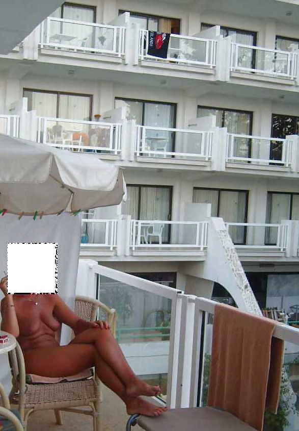 Flashing nude on a hotel balcony #28572363