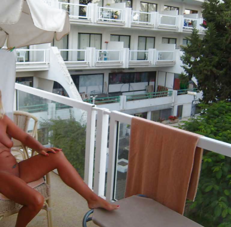 Flashing nude on a hotel balcony #28572377