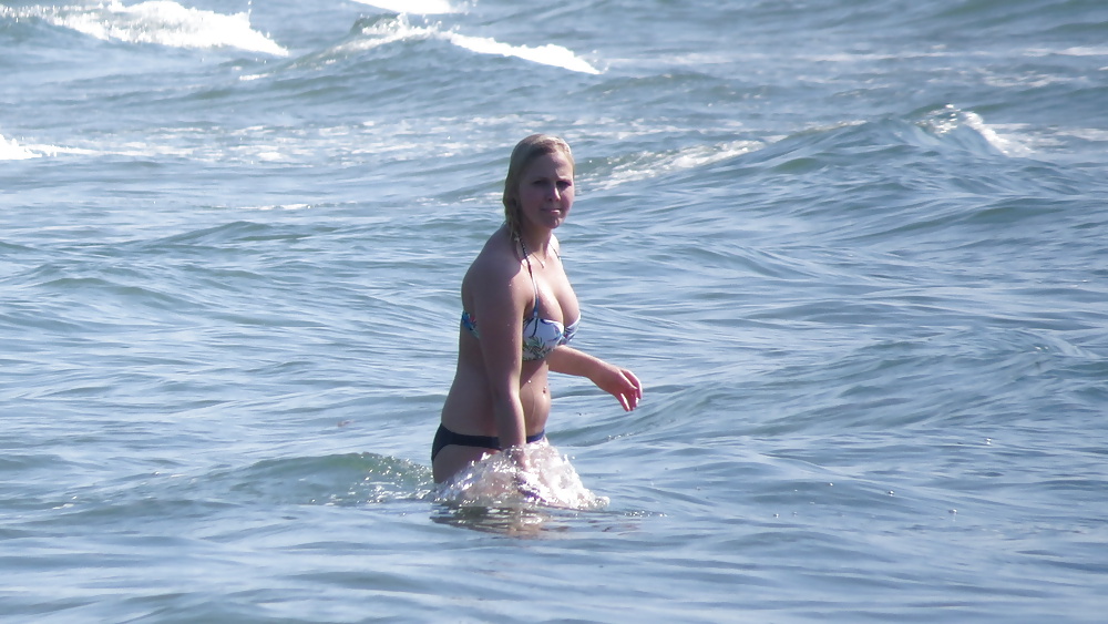 Busty blonde and her dog, playing in the waves. #39778187