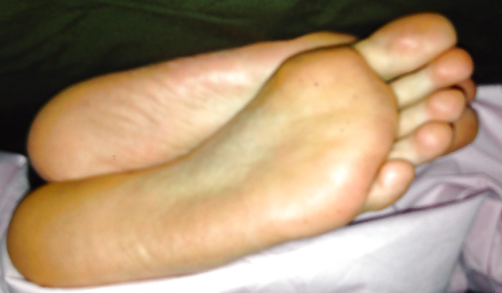 My friend's feet soles caught on bed #25107342