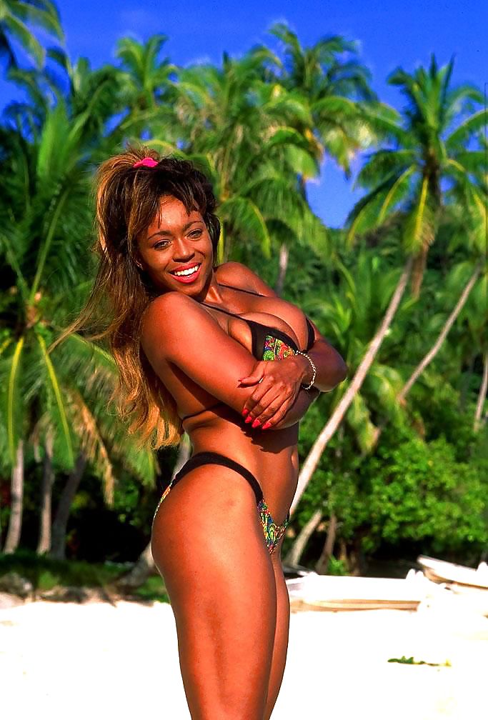 Dark busty girl posing in the tropics