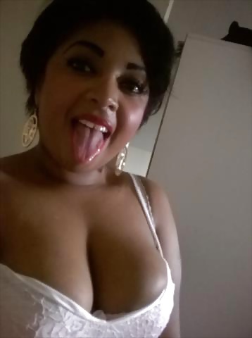 Sexy black woman showing her tongue n clivage British #40359312