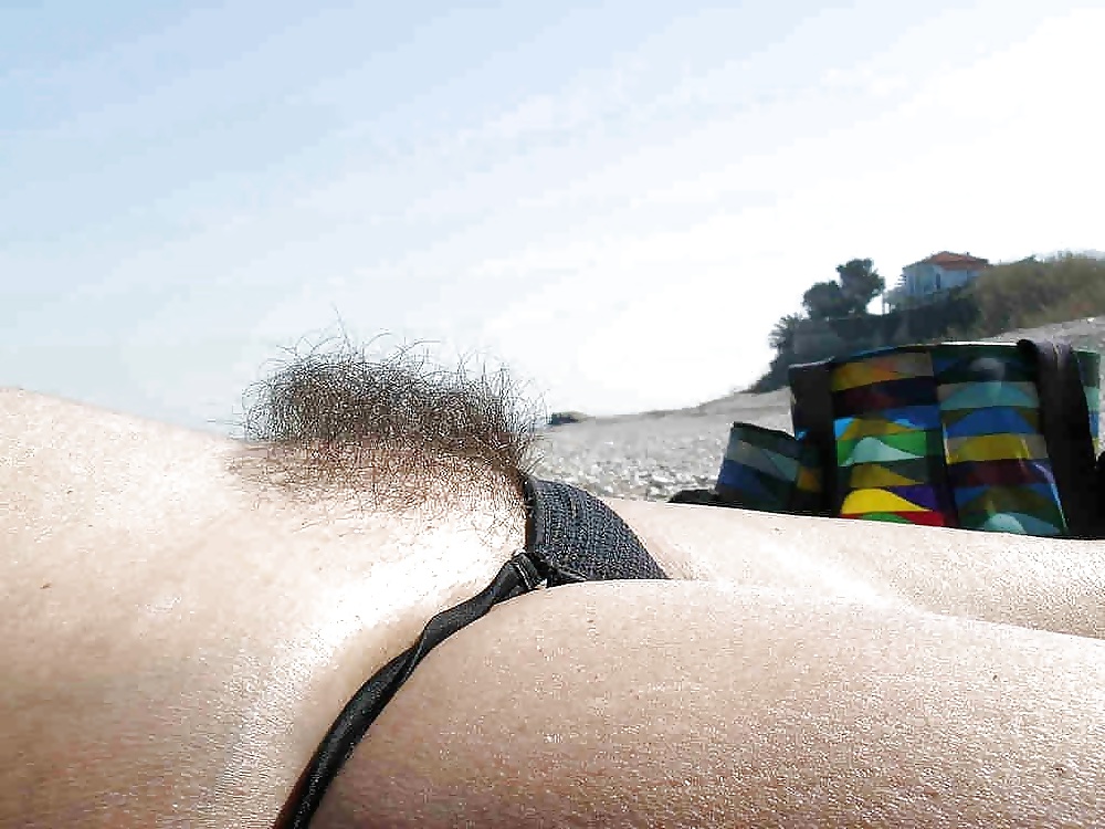 Hairy woman on the beach #40957136