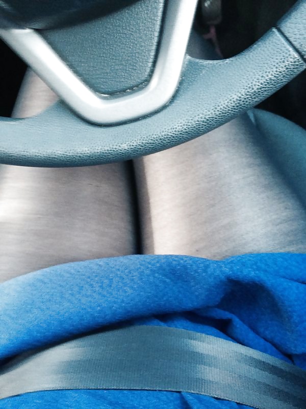Wifes legs in short skirts driving to work 
