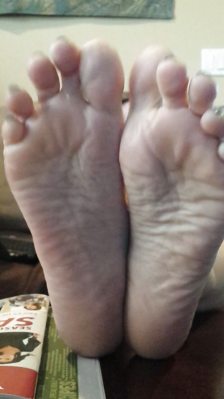 Sexy soles propped up on the table.  #38622314