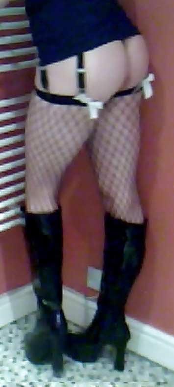 Fishnets, pvc boots and black short skirt #24401285