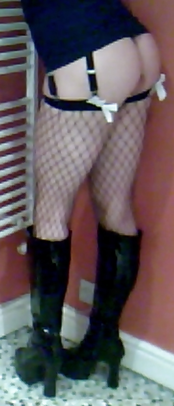 Fishnets, pvc boots and black short skirt #24401290