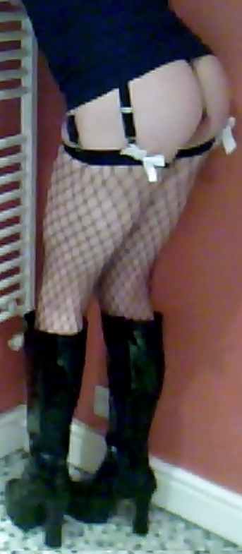 Fishnets, pvc boots and black short skirt #24401296