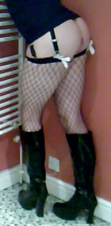 Fishnets, pvc boots and black short skirt #24401311