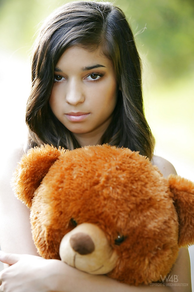 Girl Nika  playing with her teddy bear #27469982
