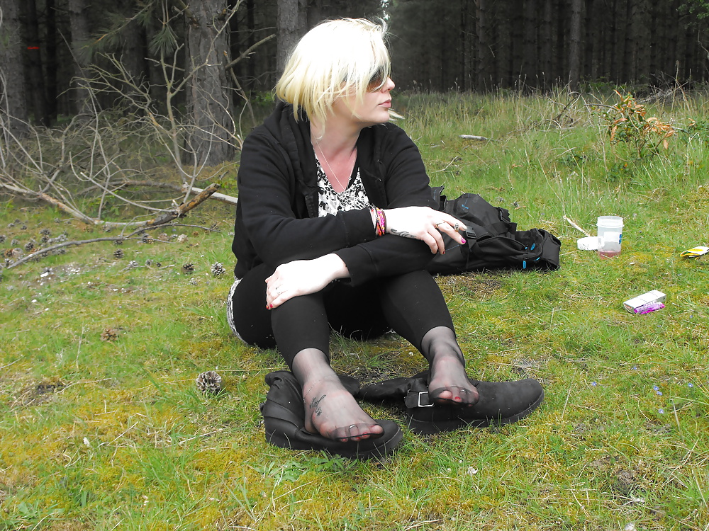 Em showing her sexy feet in the forest in black tights #28513746
