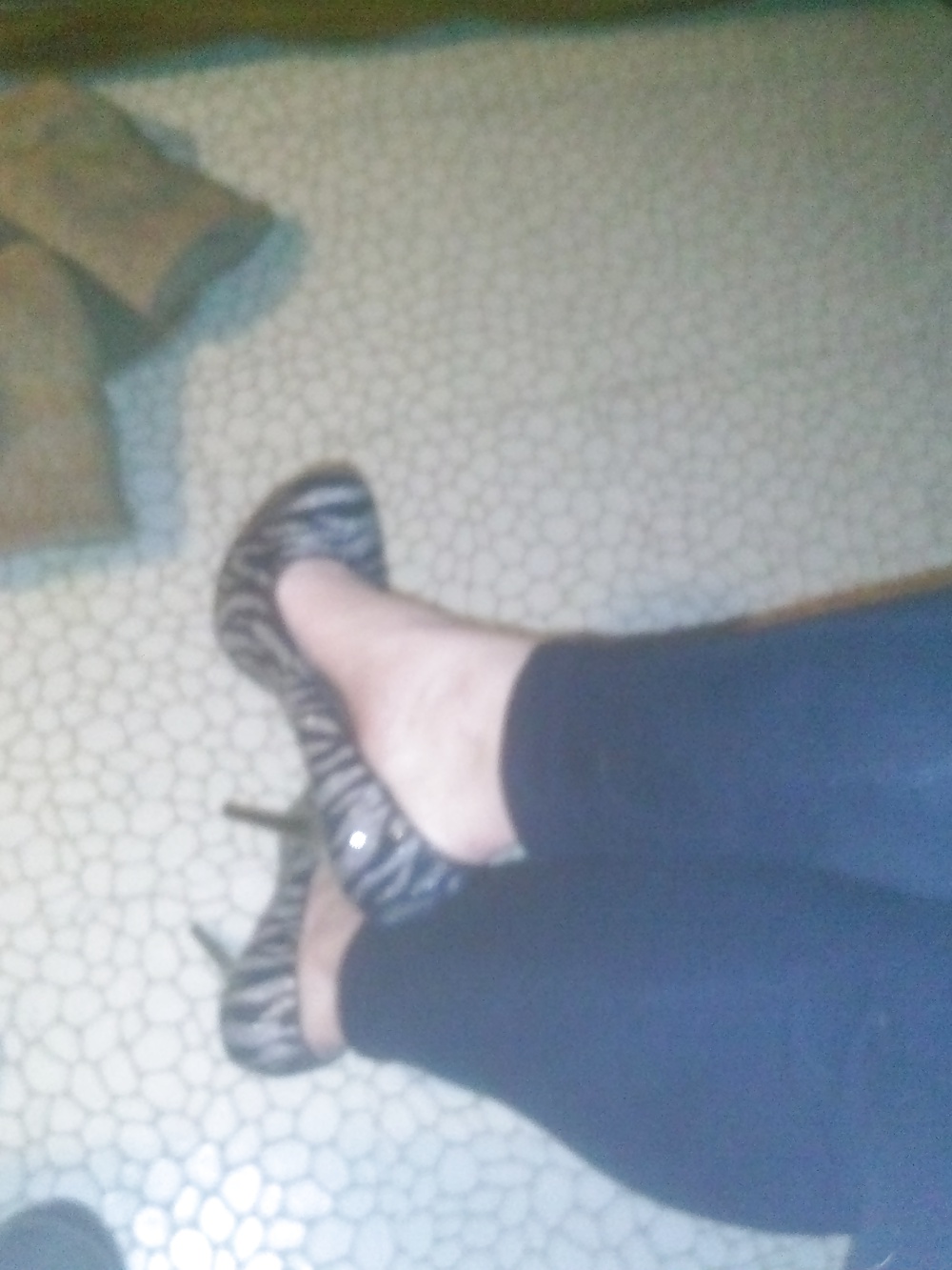 Feet in zebra heels #39670586