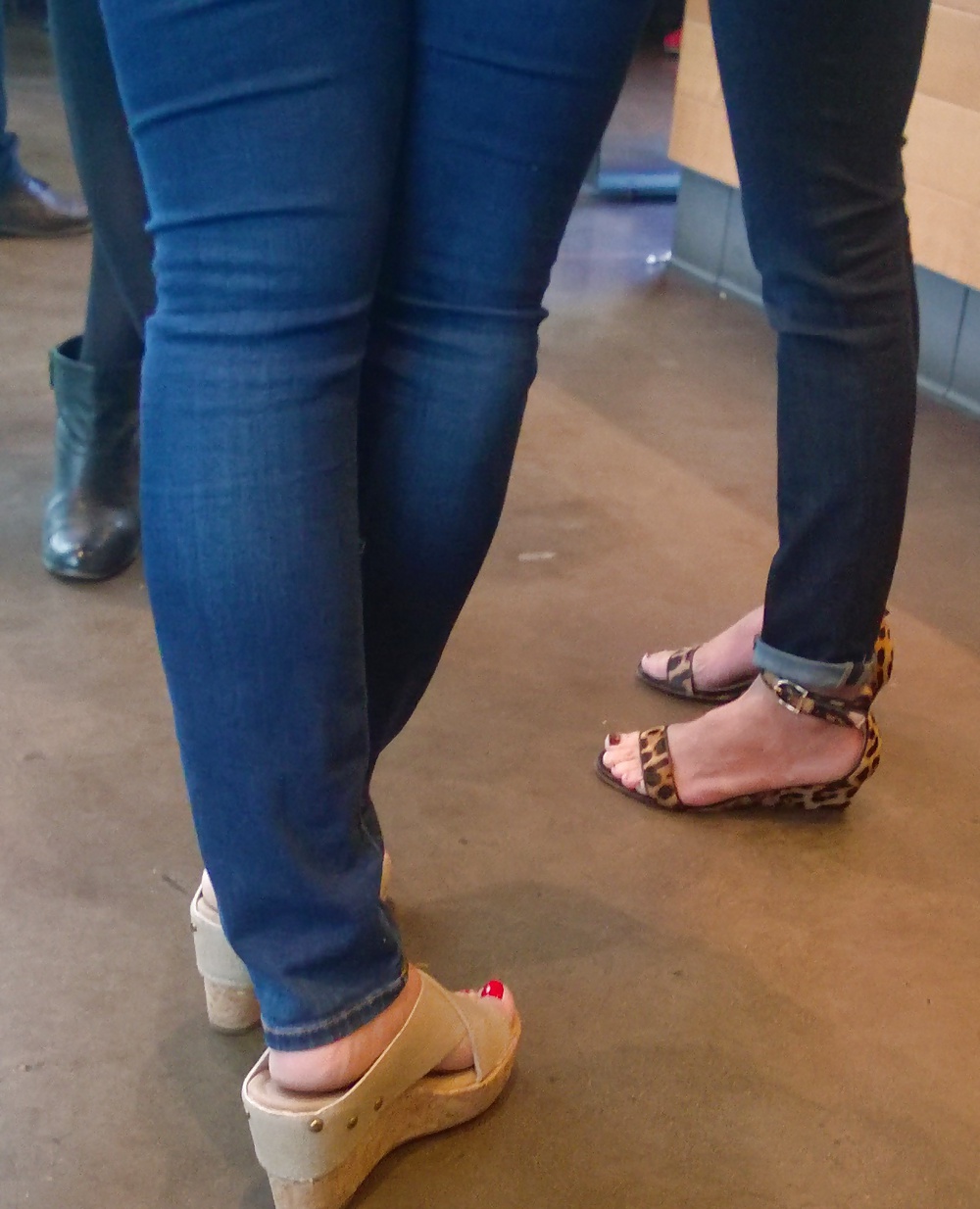 Milfs with nice asses and handsome feet wearing tight denims