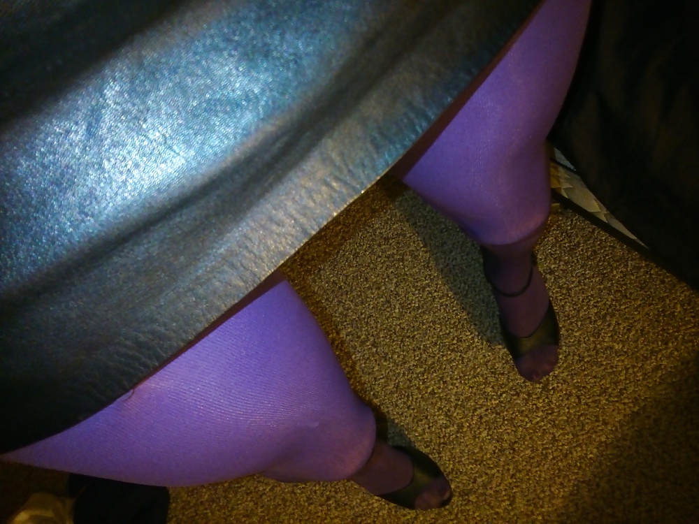 Feet And Legs In Purple Stockings, Leather Dress And Heels #33525506