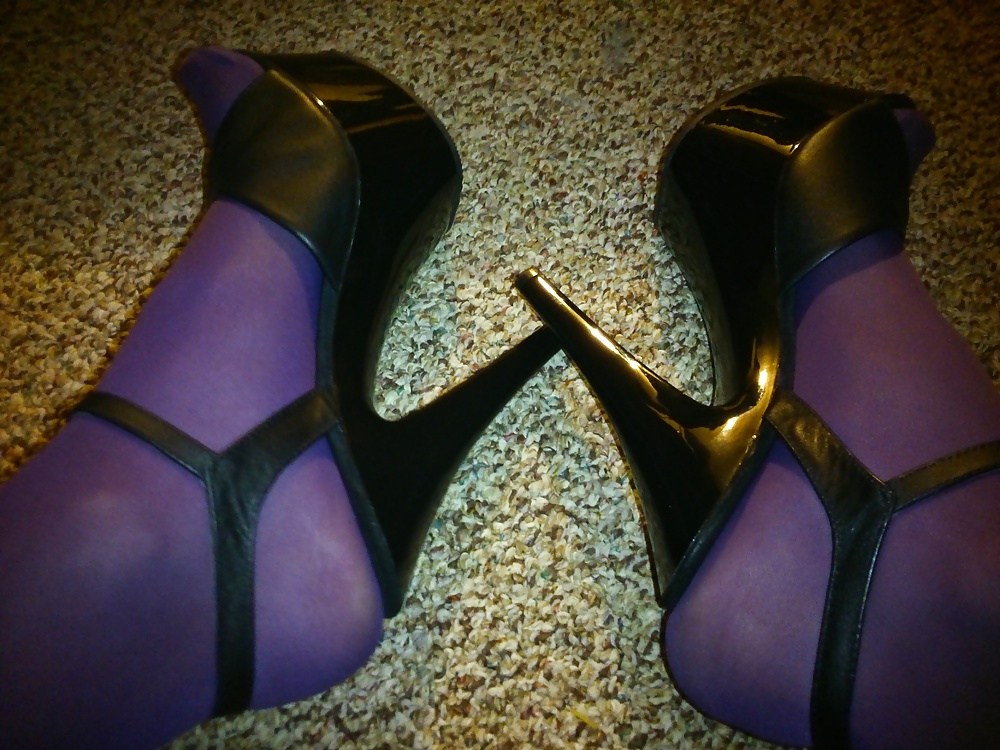 Feet And Legs In Purple Stockings, Leather Dress And Heels #33525523