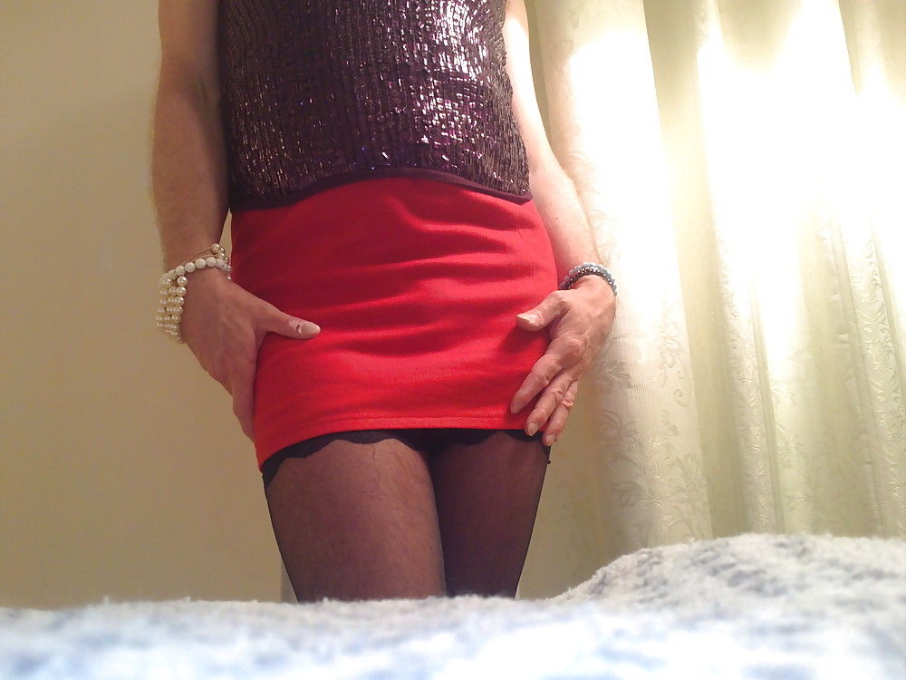 Sexy in red skirt, black stockings and sexy lingerie