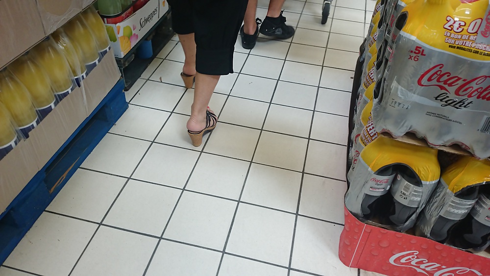 Candid heels feet and legs in supermarket #32752892