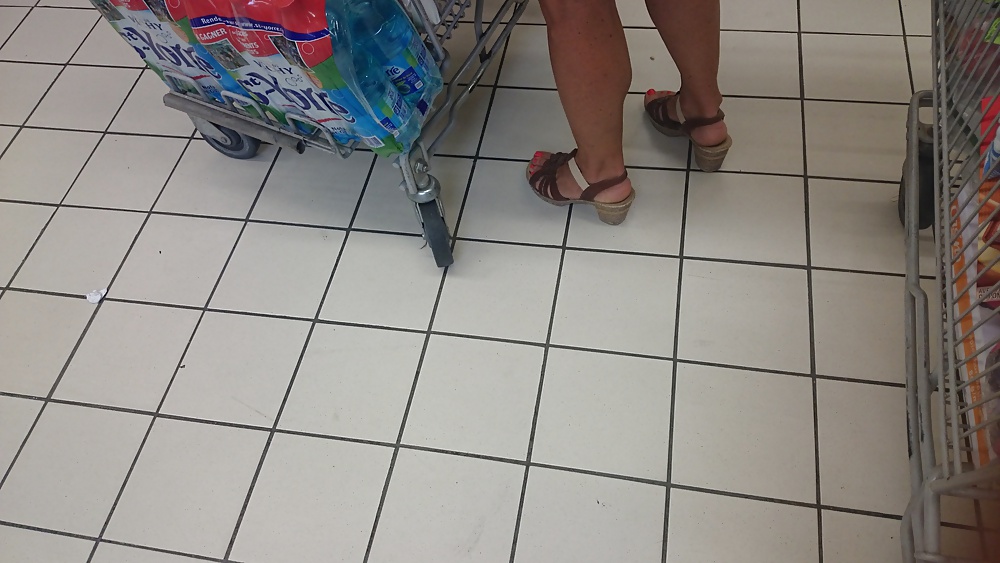 Candid heels feet and legs in supermarket #32752918