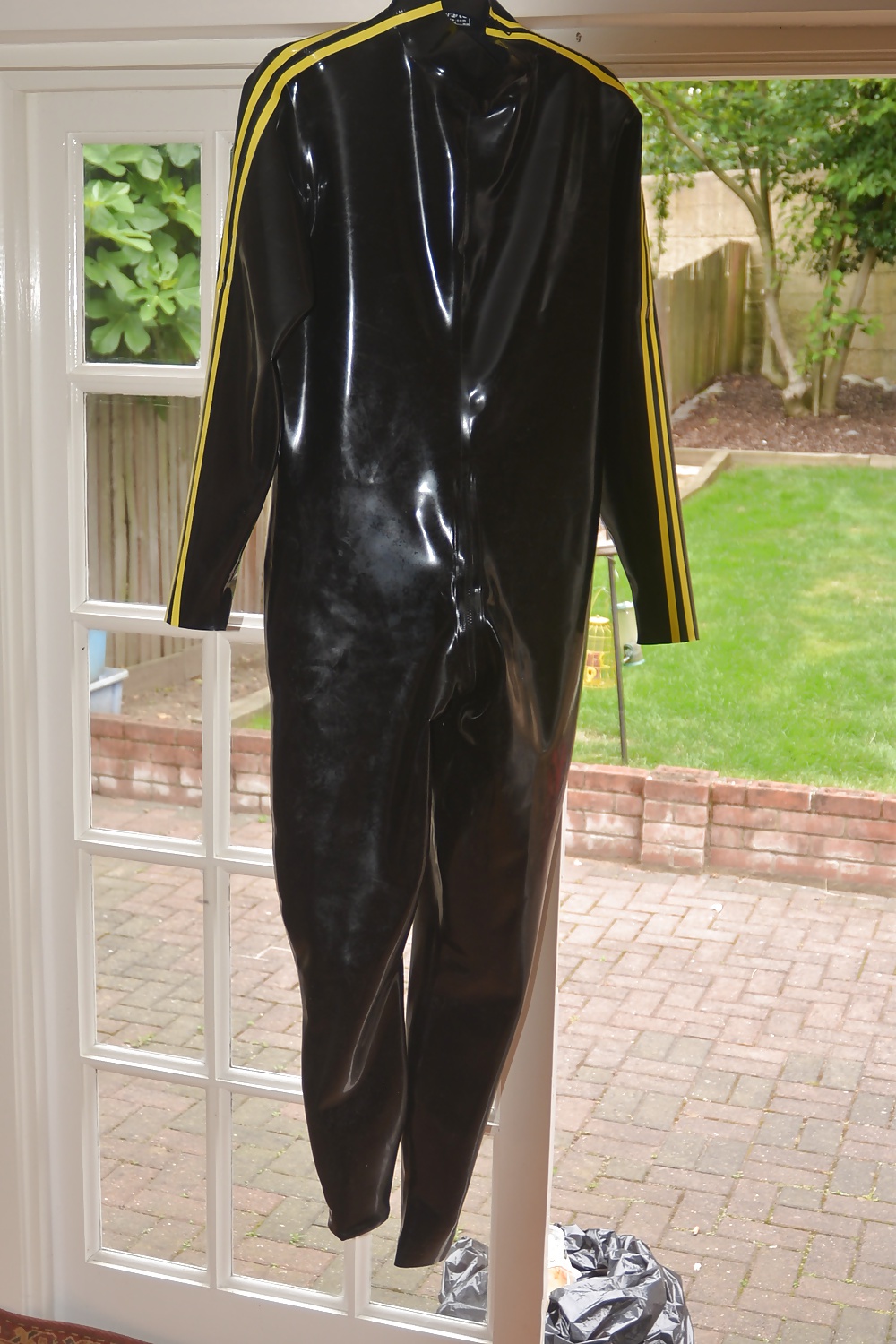 Rubber cat suit being polished #27673134