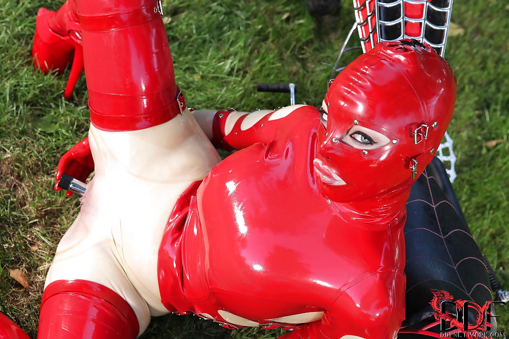 Hot fetish seductress in latex suit and mask toying her pussy outdoor #54672970