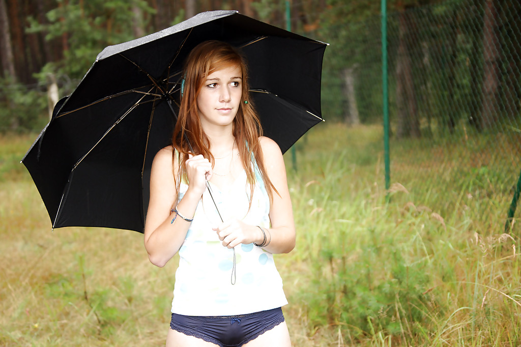 Lovely teen Anouk outdoors in the rain rubbing her smooth spread pussy #52548167