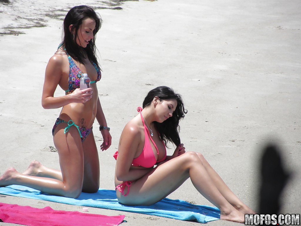 Sassy brunettes get caught on voyeur video having some fun on the beach #52358229
