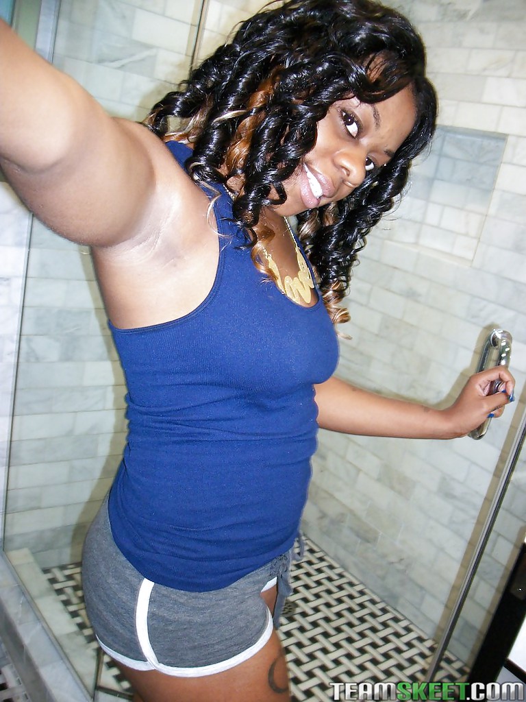 Appealing ebony babe Blue Love sticks her tongue out and masturbates #51840451