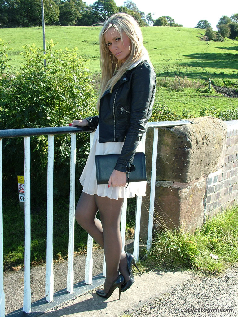 Non nude outdoor posing from a tremendous blondie in a tight skirt Erin #51370980