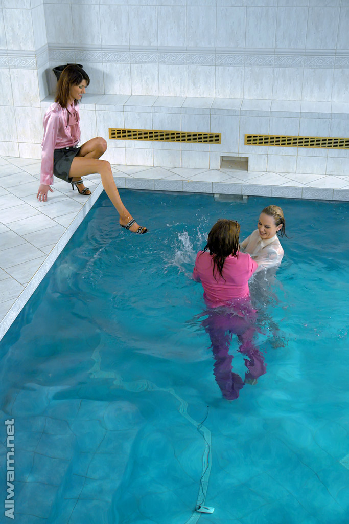 Fully clothed fetish ladies having some wet fun in the pool #52626051