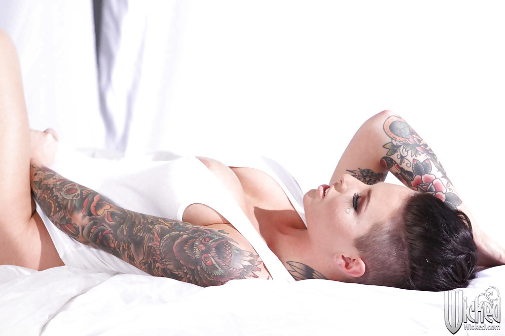 Tattooed knockout Christy Mack uncovering her flalwless curves