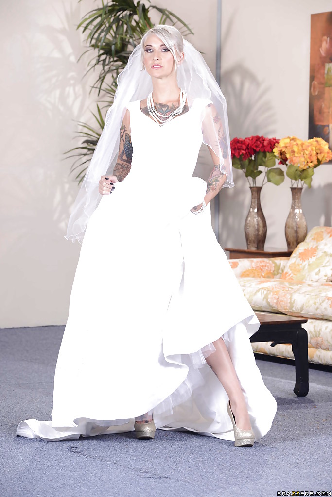 Stunning blonde bride in glamorous dress uncovering her tattooed curves #52343557