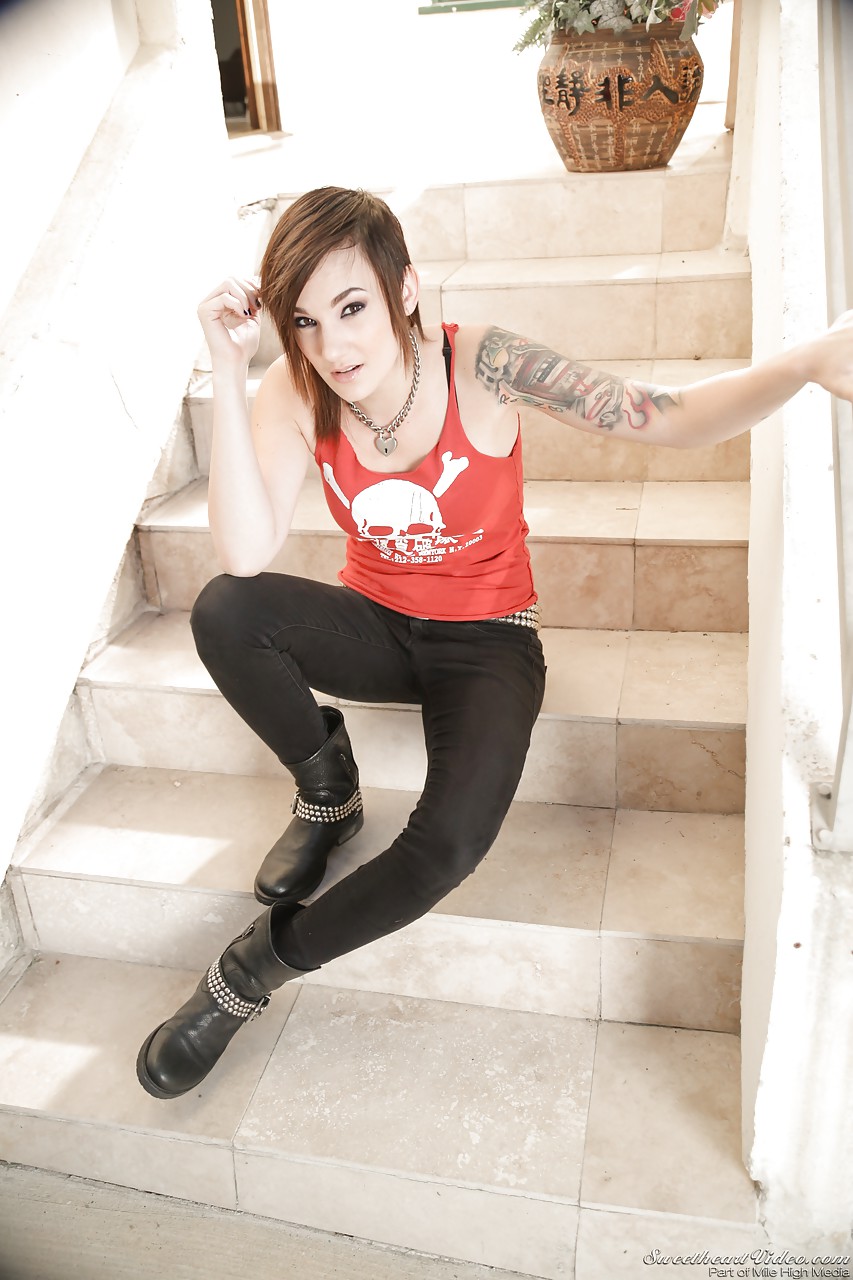 Tattooed erotic model Nikki Hearts undressing to pose naked on front steps #52148249