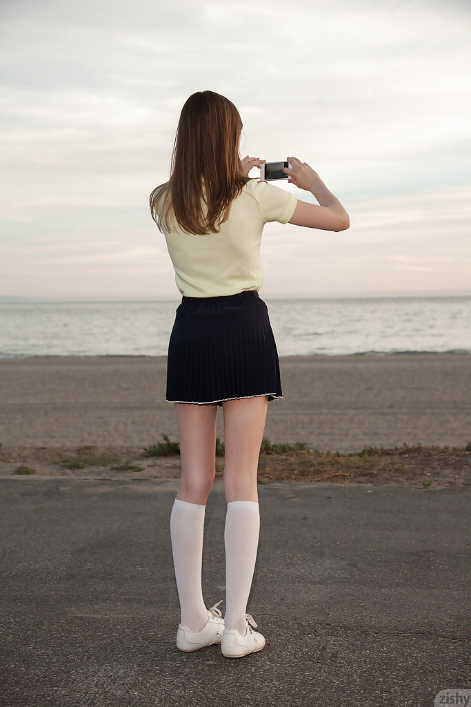 Skinny brunette teen Audrey Star posing in a skimpy skirt outdoors #50346950