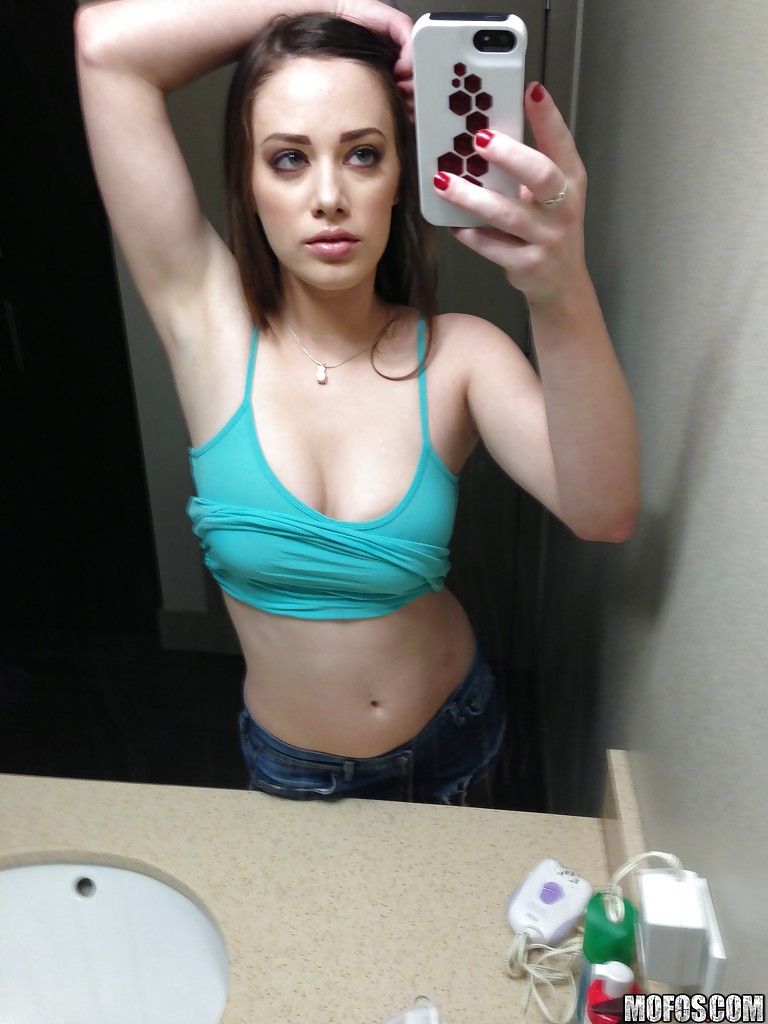 Hot amateur pictures herself as she strips down and teases her pussy