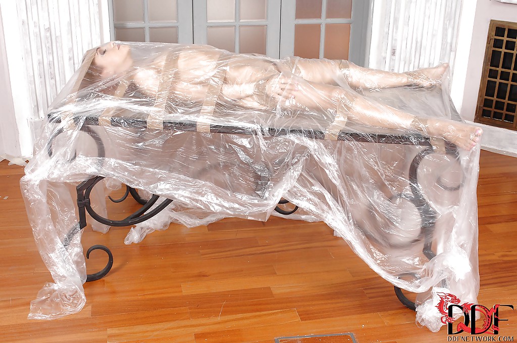 Seductive BDSM chick posing overwrapped and sticky tape-bound #50258254