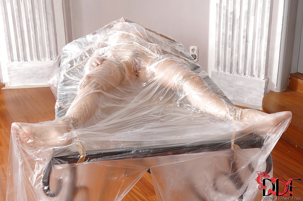 Seductive BDSM chick posing overwrapped and sticky tape-bound #50258263