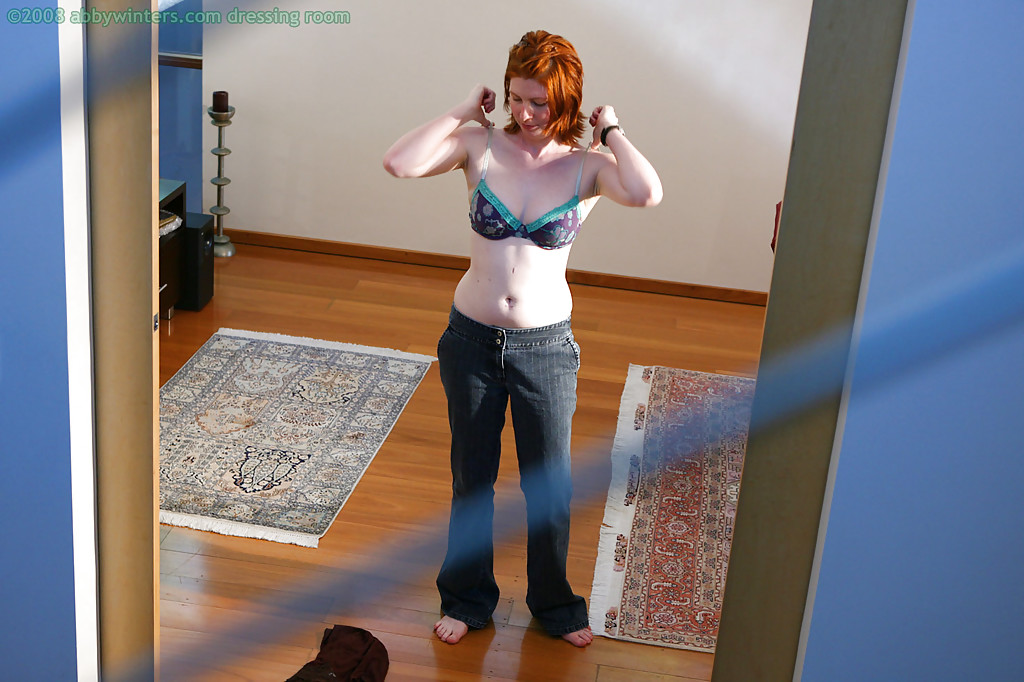 Hidden camera captures all natural redhead pulling panties over nice ass #52338985