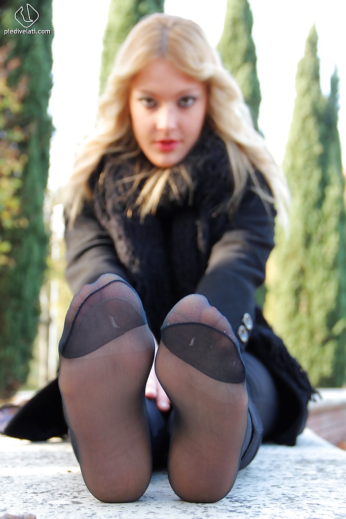 Smooth looking blonde babe Christelle in foot fetish mood outdoor #51360227
