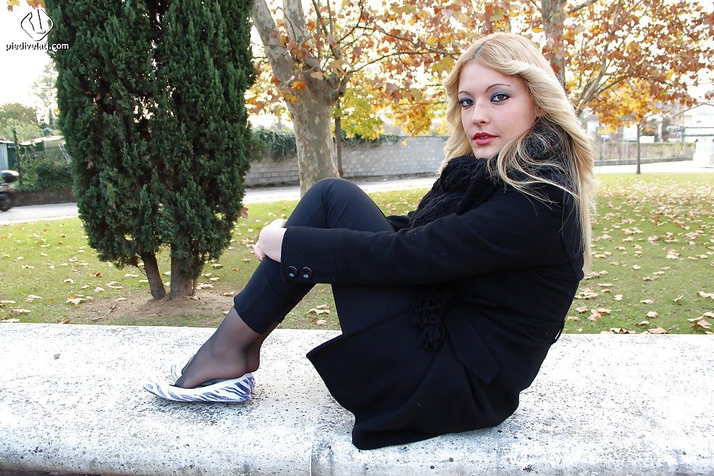 Smooth looking blonde babe Christelle in foot fetish mood outdoor #51360276