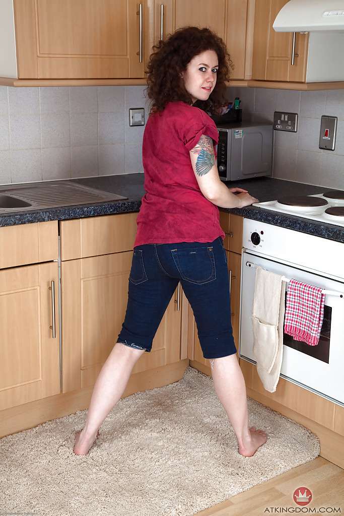 Mature brunette woman Candy revealing hairy snatch while disrobing in kitchen #50351485