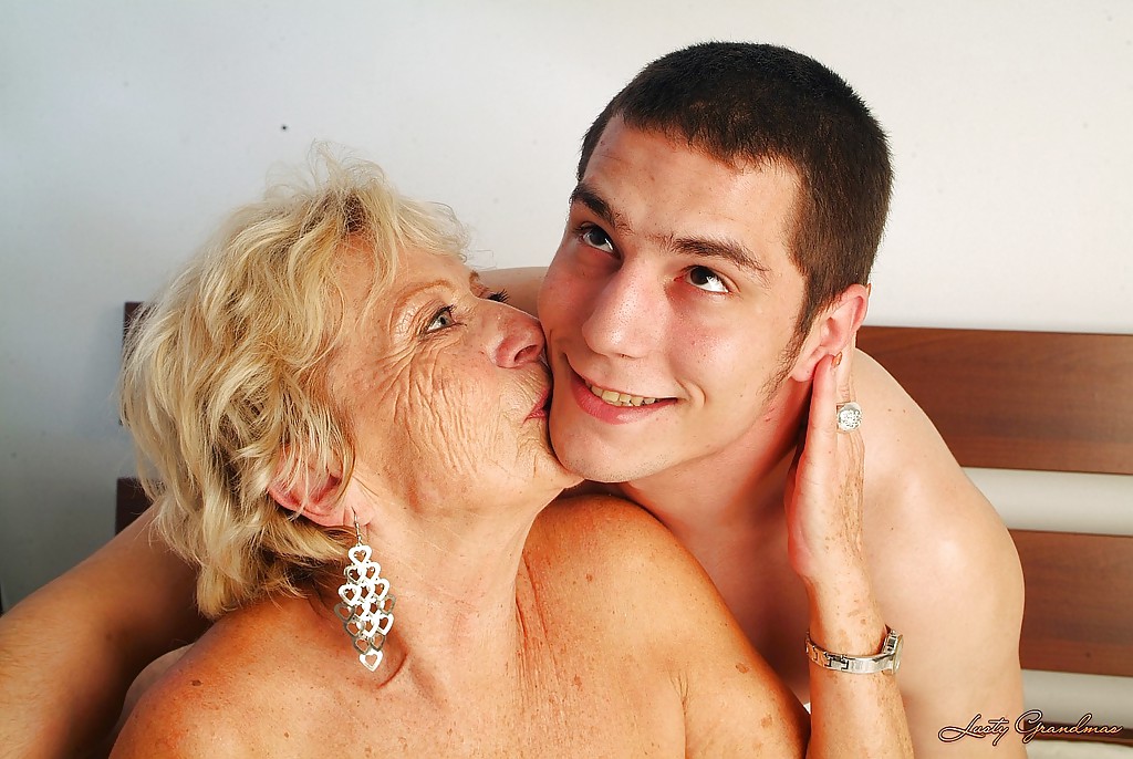 Lustful granny with massive jugs gets her hairy cunt pleased by a younger lad #51031345
