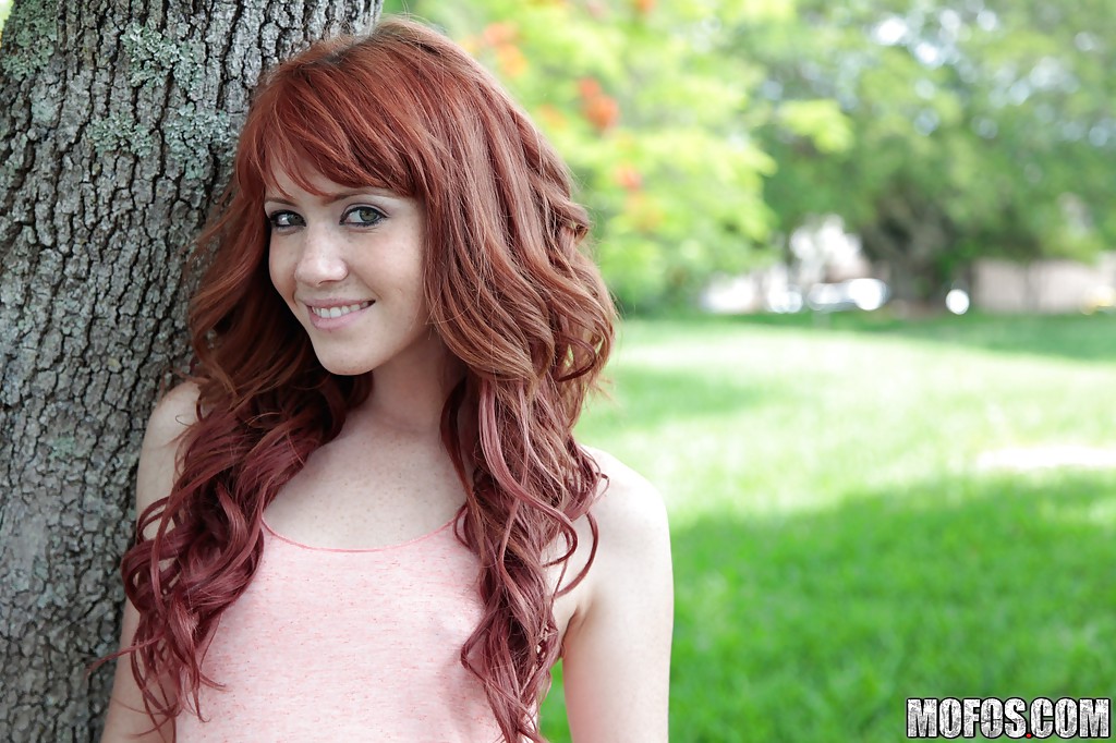 Redhead sweetie Elle Alexandra revealing her tiny curves outdoor