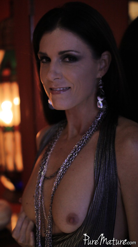 Mature brunette India Summer shows what lives beneath her long dress #51114693