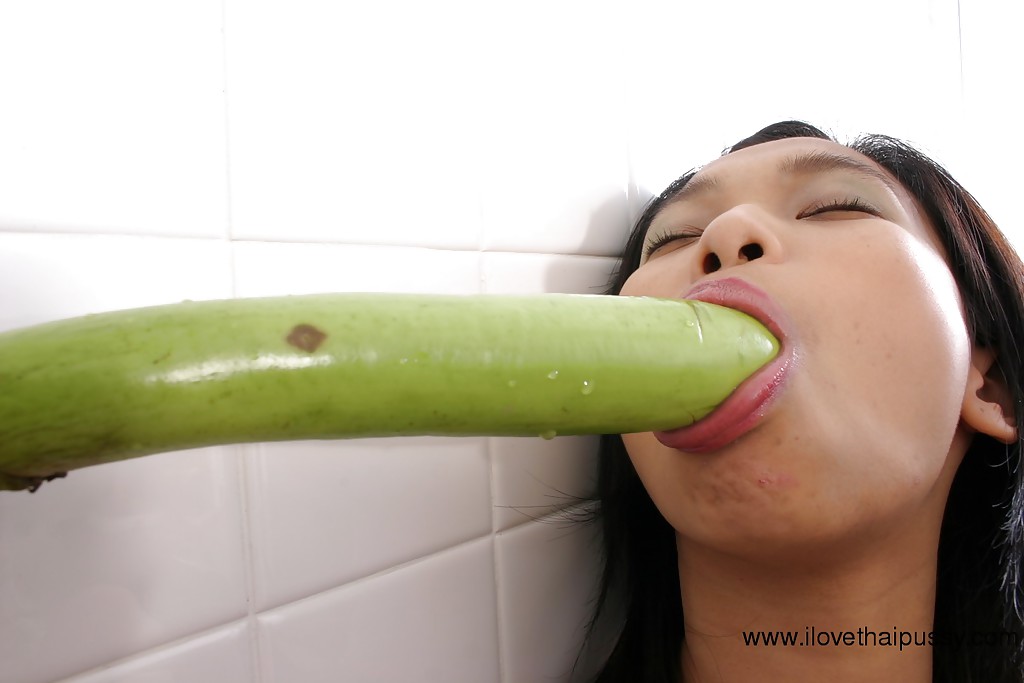 Horny Asian slut spreads hairy twat and masturbates with vegetable #50340584